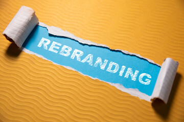 The text REBRANDING appearing