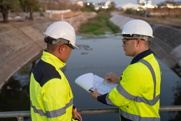 A engineering doing his checking routine. He is wearing hard hat and engineer uniform.Standing by...