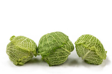 Fresh green cabbage heads on a white background
