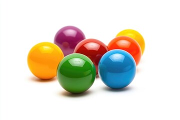 A collection of bright and vibrant balls placed on a clean white surface, ideal for use in illustrations, designs, or educational materials