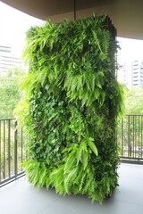 Lush vertical garden showcasing diverse green foliage in urban e