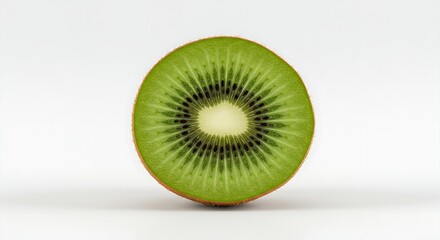 A kiwi fruit sliced in half, displaying its vibrant green color and tiny black seeds on a white background