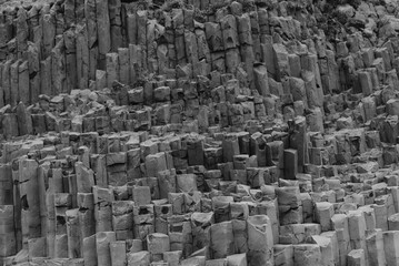 the stunning basalt columns of Iceland, characterized by their unique geometric shapes and dramatic natural beauty against a backdrop of rugged landscapes