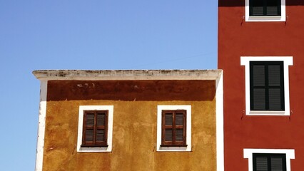 building facades with windows and shutters
