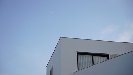 modern facade with window against blue sky