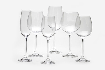 Wine glasses arranged symmetrically, awaiting sommelier sampling or festive toasting