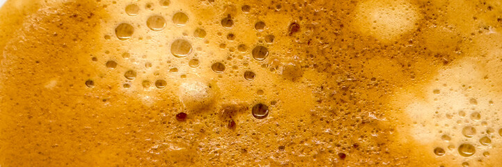 Close-up of creamy coffee froth with bubbles, morning energy boost, cozy beverage enjoyment,...