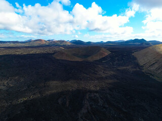 Fototapeta premium Aerial View of a Dormant Volcanic Crater in a Rugged, Barren Landscape