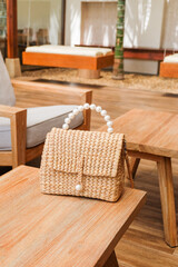 Rattan bag on wooden table,Straw bags or wicker bags,wicker baskets made of natural material,vintage weave wicker baskets,space for sale,copy space.