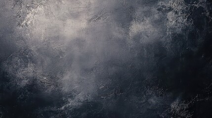 Obraz premium A textured dark abstract background with a mix of blacks and subtle gray tones, creating a moody atmosphere.