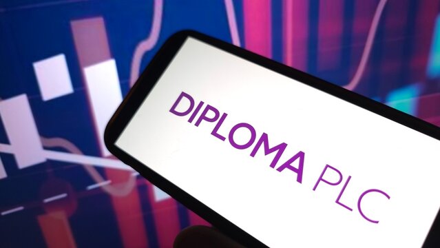 Konskie, Poland - February 22, 2025: Diploma plc company logo displayed on mobile phone