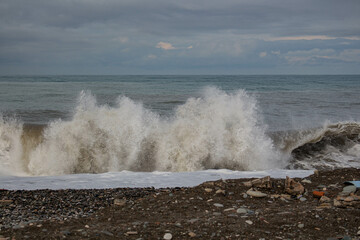 Fototapeta premium Waves on the beach. Splash of a wave. Storm at sea. Seascape in a storm.