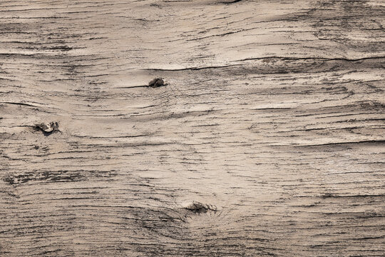 Background image: aged wood surface with knots and cracks