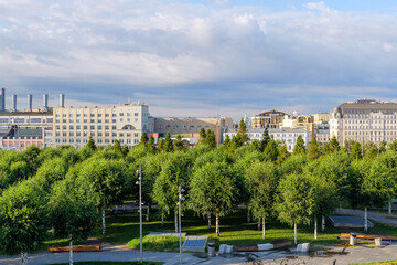 summer morning in central Moscow, Zaryadye Park with lush greenery and a panoramic city view. A quiet moment before the city wakes up