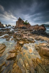 Landscape and seascape of rocky beach at Shark Tooth Beach Kelumbayan Lampung