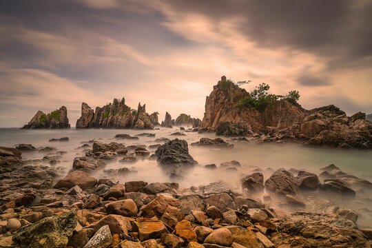 Landscape and seascape of rocky beach at Shark Tooth Beach Kelumbayan Lampung