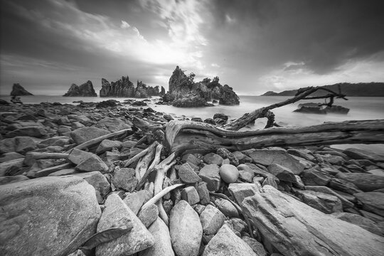 Landscape and seascape of rocky beach at Shark Tooth Beach Kelumbayan Lampung