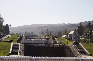 A ladder of locks in the Caledonian Canal, cutting through the main town center of Fort Augustus, Scotland