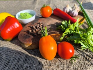 Vegetables and fruits are spices on a sliced board. High quality photo