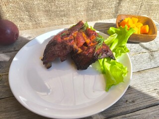 fried ribs on a white plate. High-quality photos