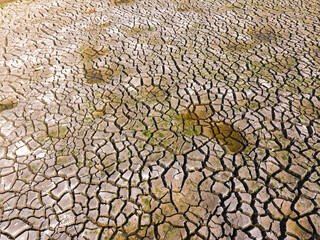 Dry and cracked ground land. Global warming and climate change. Environmental pollution by chemical waste.