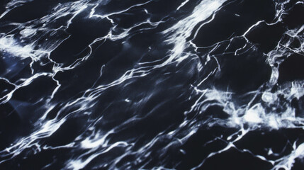 Marble-like glossy black formica with bright reflections for interior design and decoration