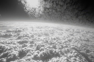 A black and white photograph capturing the expanse of clouds in the sky Monochromatic representation of a cloudy sky .