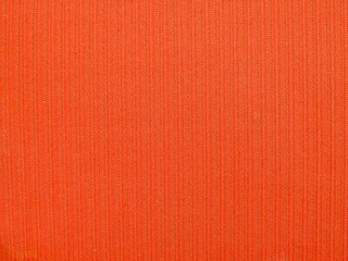 shabby worn old fabric woven from cotton and wool with a striped pattern red-orange color, fragment full frame, piece of furniture upholstery retro style material