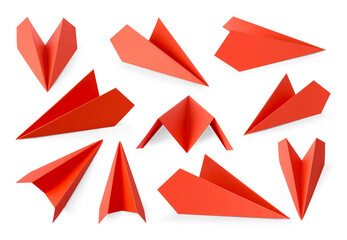 Red paper planes on white background, set