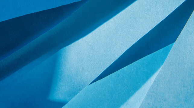 Abstract blue paper texture with sharp angular ribbed design for creative backgrounds