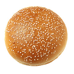 Sesame seed bun, top view, isolated.