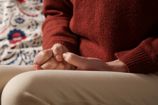 Close up of woman picking at cuticles, Skin picking disorder - classified as Obsessive-Compulsive and Related Disorders