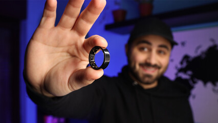 Man holding a smart ring