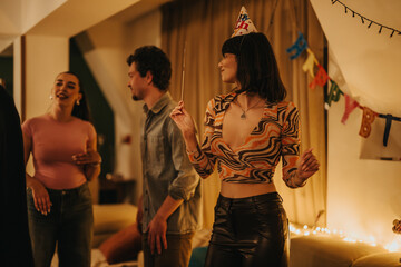 A group of friends enjoying a birthday celebration at home, featuring dancing and fun with festive decorations. A warm and cheerful atmosphere highlights this special occasion.
