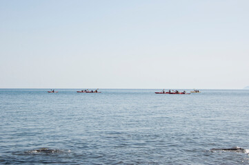 Kayak paddle sea vacation. Leisure active lifestyle recreation activity rest tourism travel. Kayak water sport. Group of kayaker are having fun in winner poses at sea bay