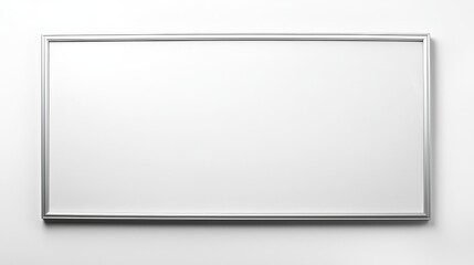 A simple, rectangular wall mirror with a sleek silver frame against a plain white background.