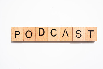 the word podcast in wood type
