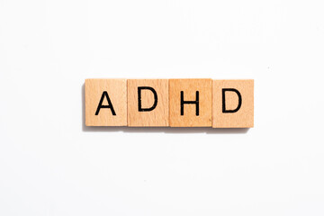 ADHD in wooden tiles on white background 