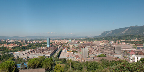 Fototapeta premium Stitching panoramic view of the city of Terni in Italy with the steel mills in the foreground and the city in the background 