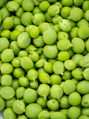 macro close-up of fresh organic green peas - food and agriculture concept