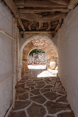 Fototapeta premium Picturesque main village of Kimolos island with beautiful cycladeic architecture built above of port Psathi, Cyclades, Greece