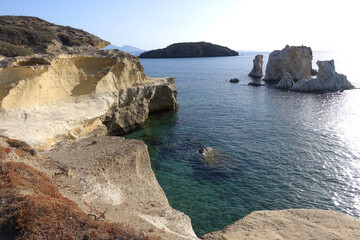 Obraz premium Paradise sandy organised beach of Mavrospilia with white rock formations best place to see the sunset in the island of Kimolos, Cyclades, Greece