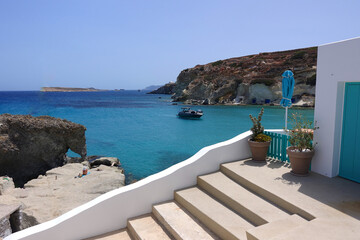 Fototapeta premium Picturesque seaside area and bay of Goupa - Karra with colourful boat houses a perfect place to swim, Kimolos island, Cyclades, Greece