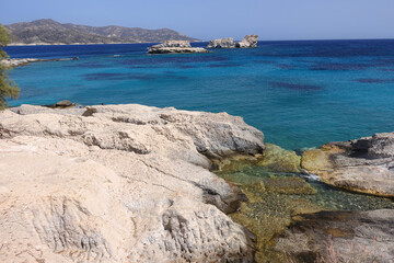 Picturesque seaside area and bay of Goupa - Karra with colourful boat houses a perfect place to swim, Kimolos island, Cyclades, Greece