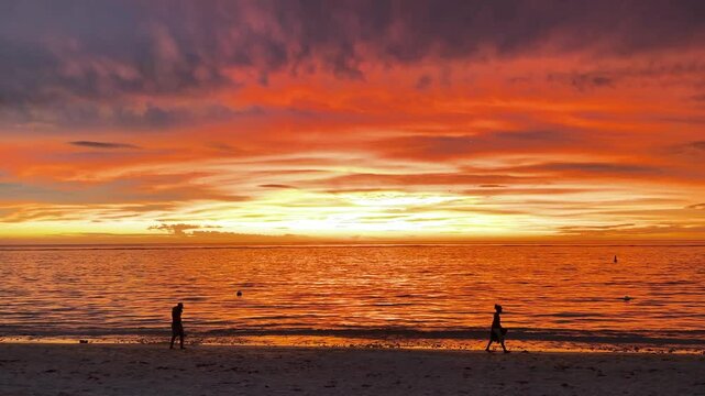 Amazing extraordinary sunset in an orange sky with soft clouds. Colorful sunset. Epic clouds. no filters