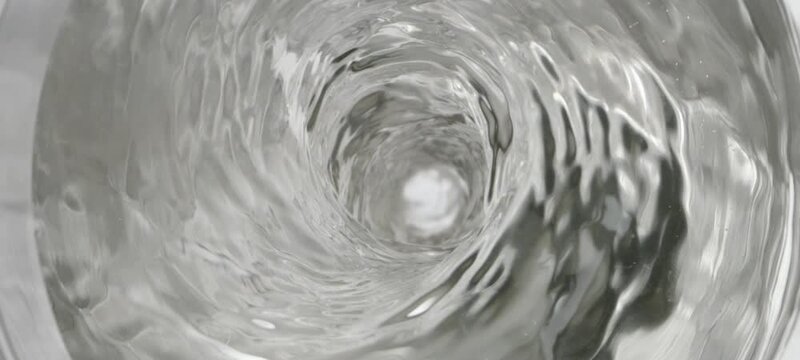 Extreme close-up view cinematic shot of rotating water whirl at 1000 fps