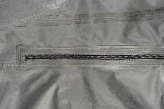 Outerwear fabric. Taped seams of fabric. Waterproof fabric with taped seams. Clothing made of waterproof fabric.