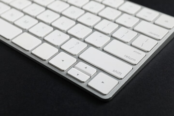 Technical support concept. Modern keyboard on black background, closeup