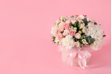 Bouquet of beautiful flowers on pink background, space for text