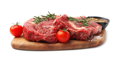 Pieces of raw beef meat, spices and tomatoes isolated on white